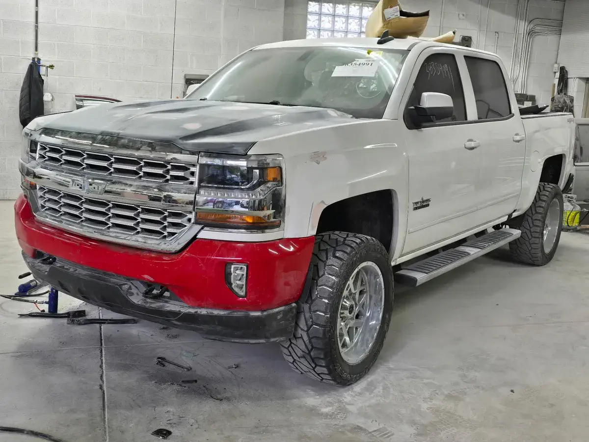 Chevrolet Silverado with body damage before repair