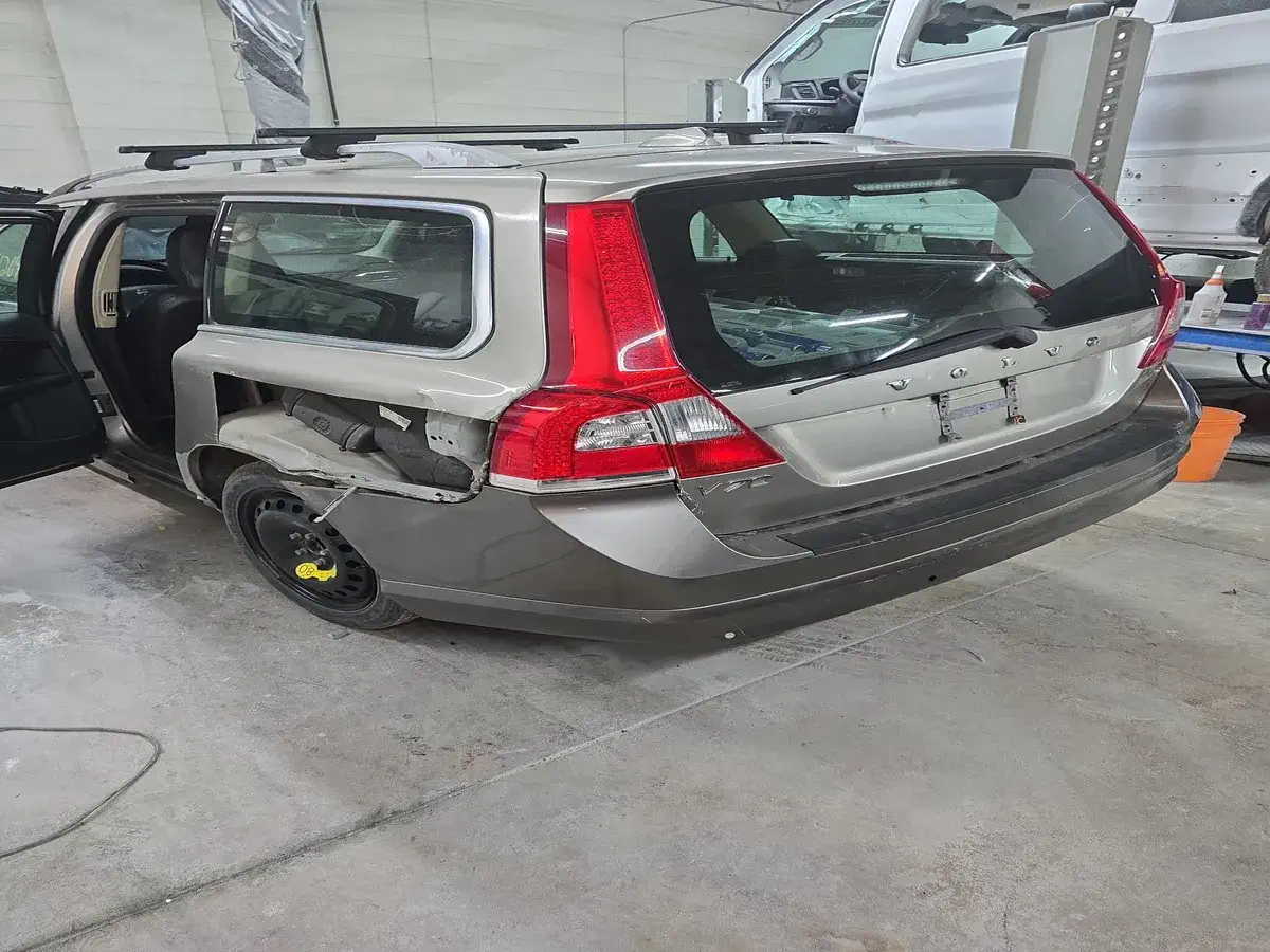 Gray Volvo with rear end damage before repair